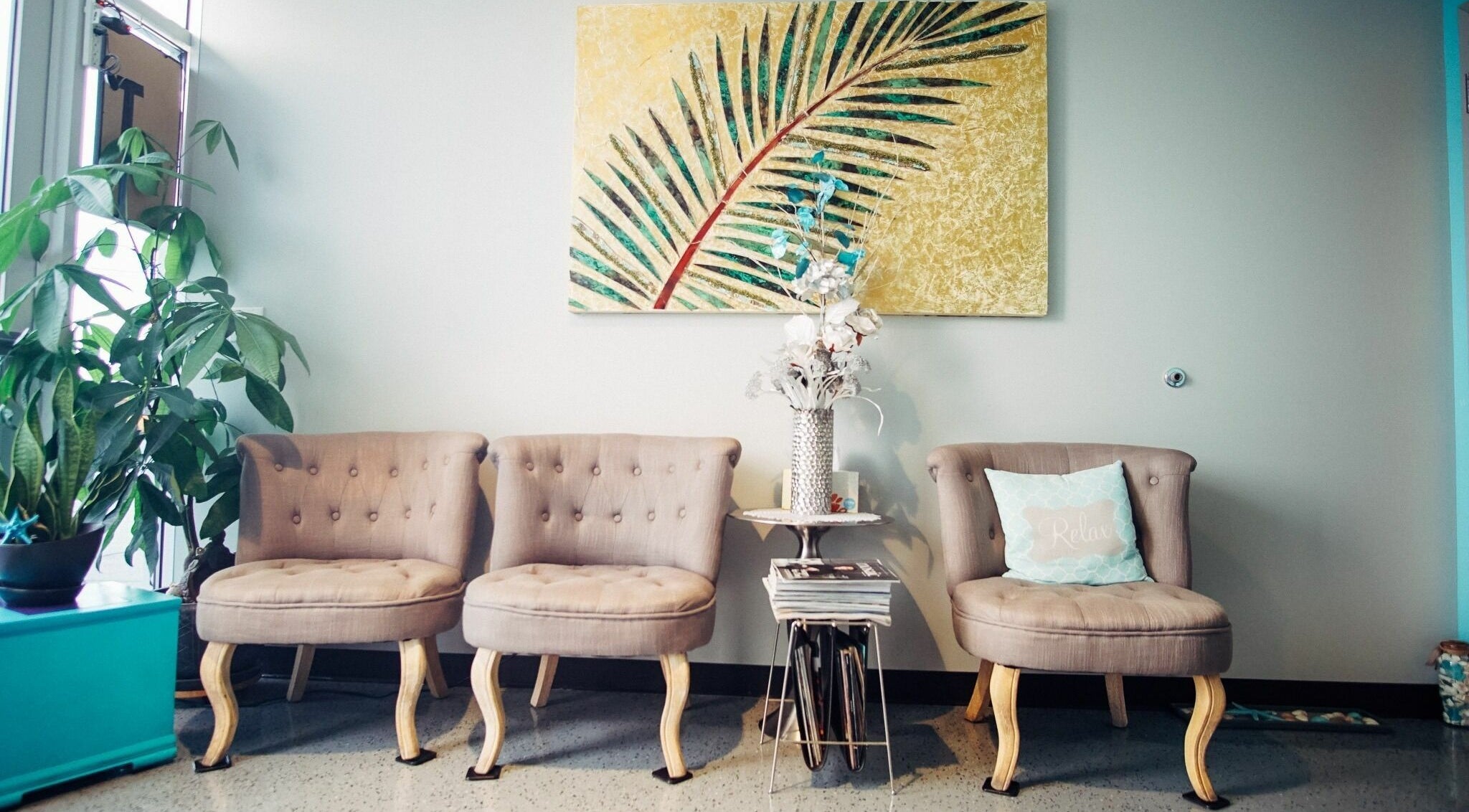 Comfortable seating area at Silver Sea Day Spa in San Jose, California, US with elegant decor and lush plant.