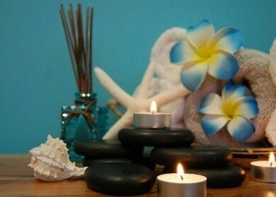 Serene candles and stones at Silver Sea Day Spa in San Jose, California, US create a calming ambiance.