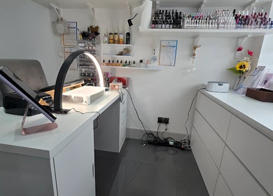 Modern nail salon at Inspired Nails, Northbourne, England, GB, featuring a sleek workspace with organized tools.