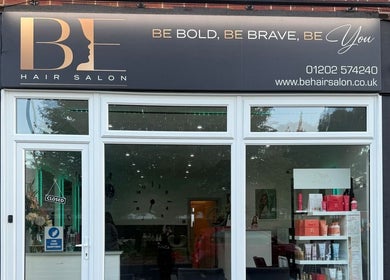 Entrance of Inspired Nails, Northbourne, England, GB with glass display and signage.