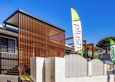 Exterior of Plush Skin Body and Beauty in East Toowoomba, Queensland, AU with vibrant signage and sleek design.