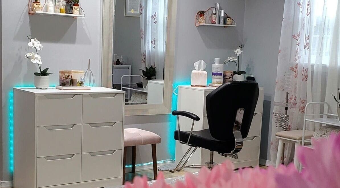 Modern styling station at EK Beauty Center, Homewood, Illinois, US, featuring elegant decor and orchids.