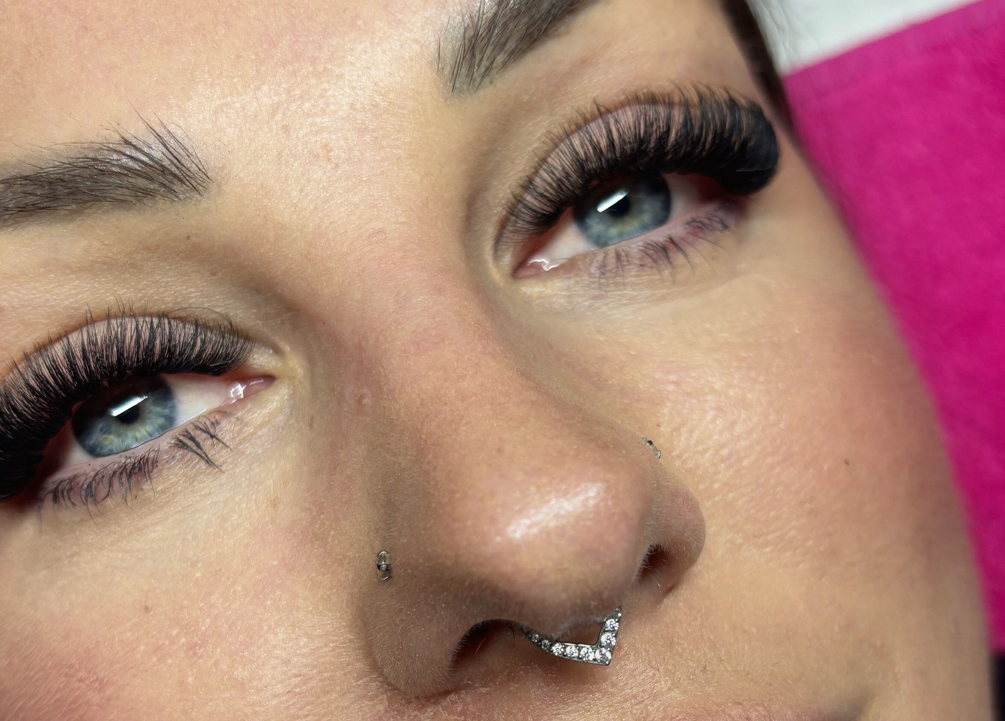 Close-up of elegant eyelash extensions at Wild Honey Lash Co, Calgary, Alberta, CA, showcasing beauty enhancement.