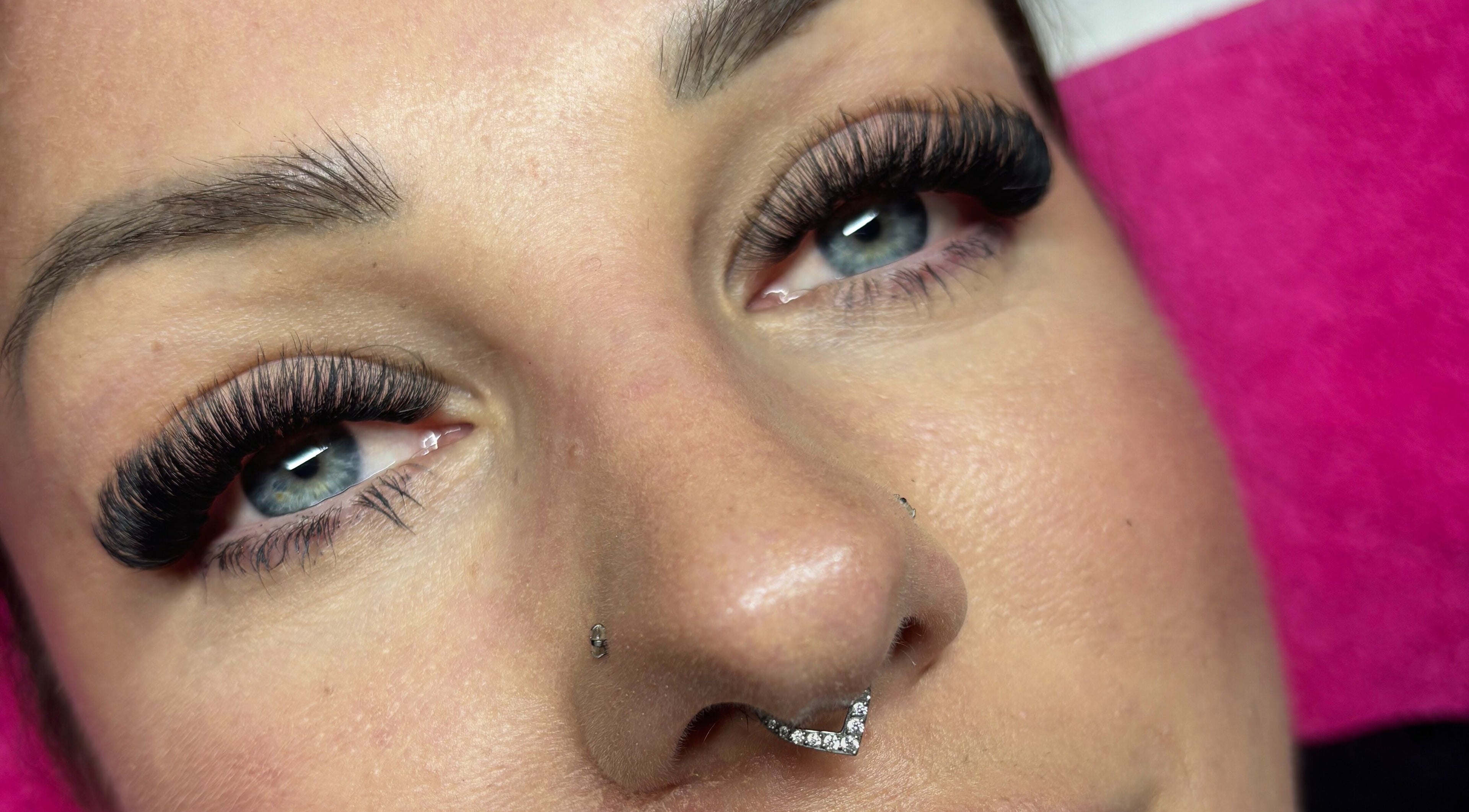 Close-up of elegant eyelash extensions at Wild Honey Lash Co, Calgary, Alberta, CA, showcasing beauty enhancement.