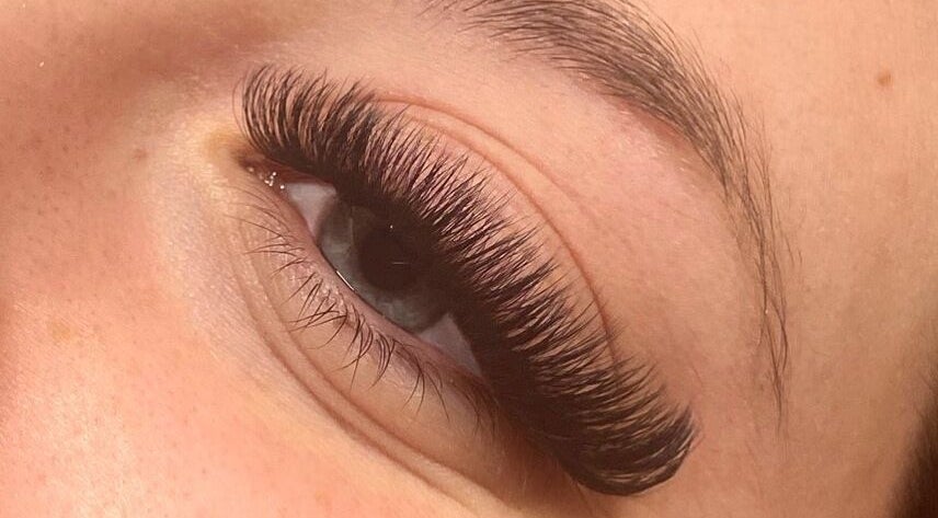 Close-up of eyelash extensions at Wild Honey Lash Co, Calgary, Alberta, CA, showcasing volume and precision.