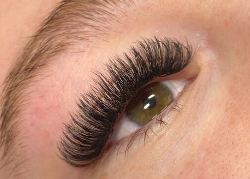 Close-up of lush eyelash extensions by Wild Honey Lash Co in Calgary, Alberta, CA.