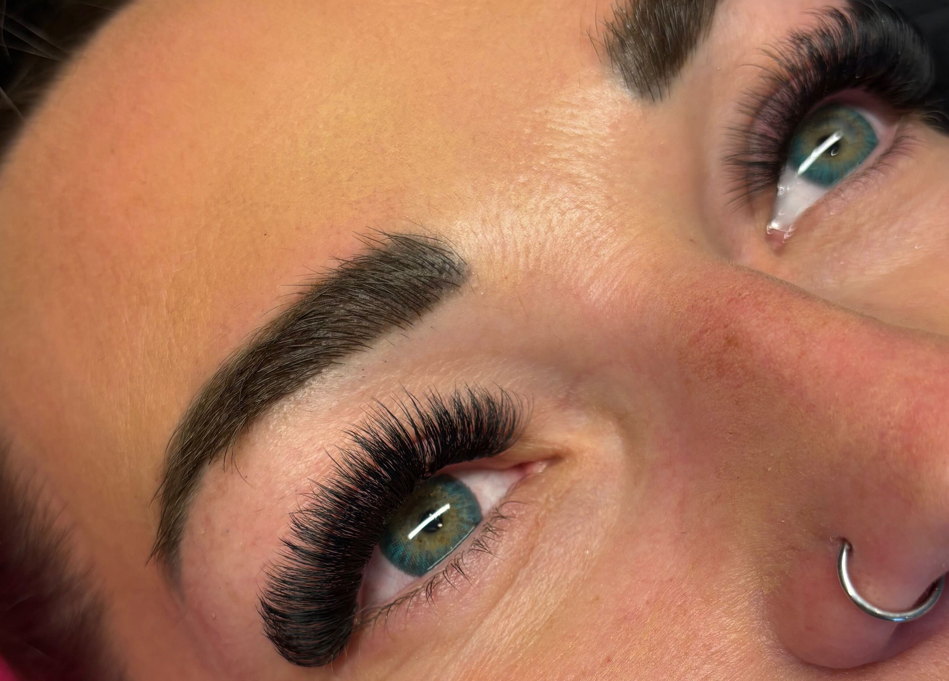Close-up of expertly styled lashes by Wild Honey Lash Co, located in Calgary, Alberta, CA.