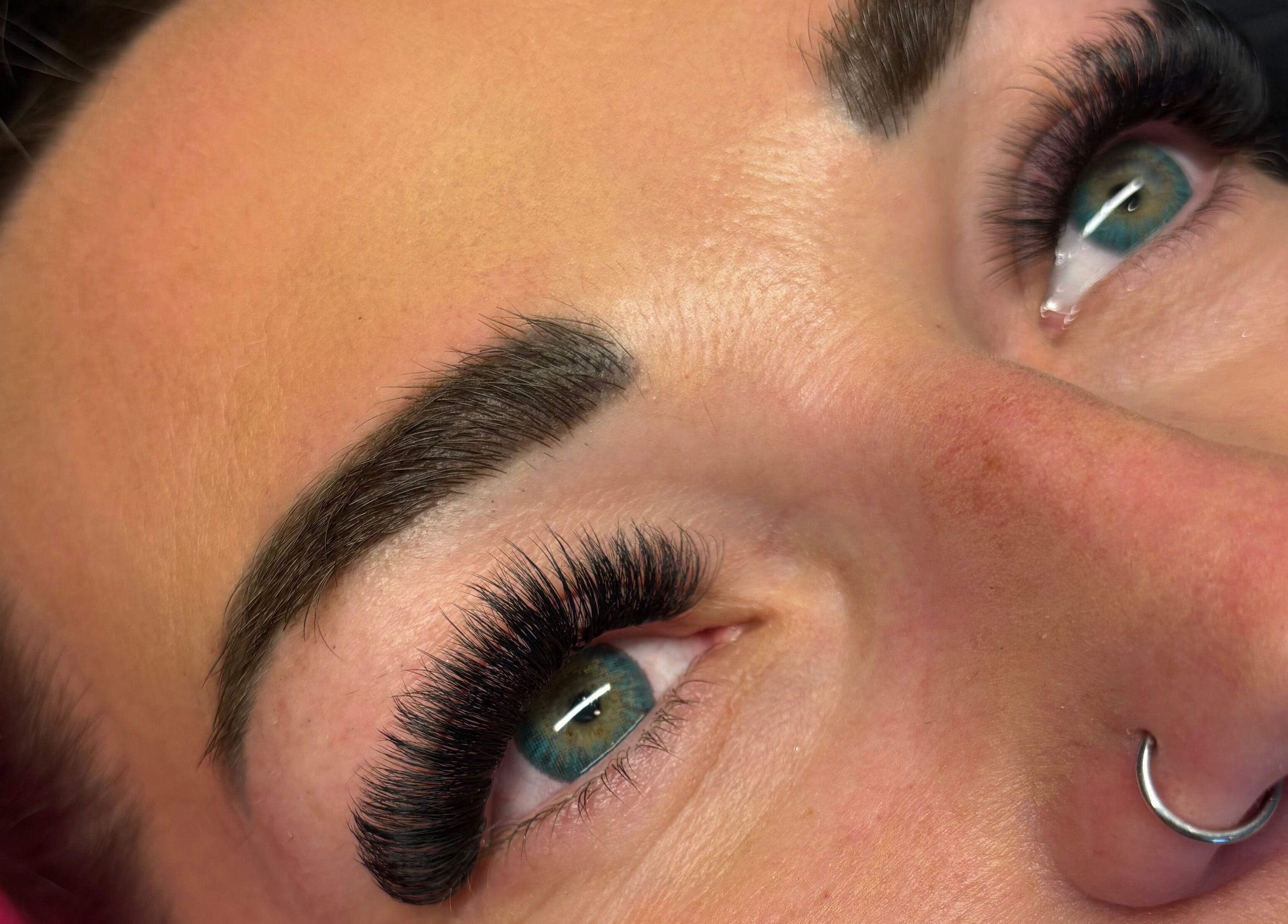 Close-up of expertly styled lashes by Wild Honey Lash Co, located in Calgary, Alberta, CA.