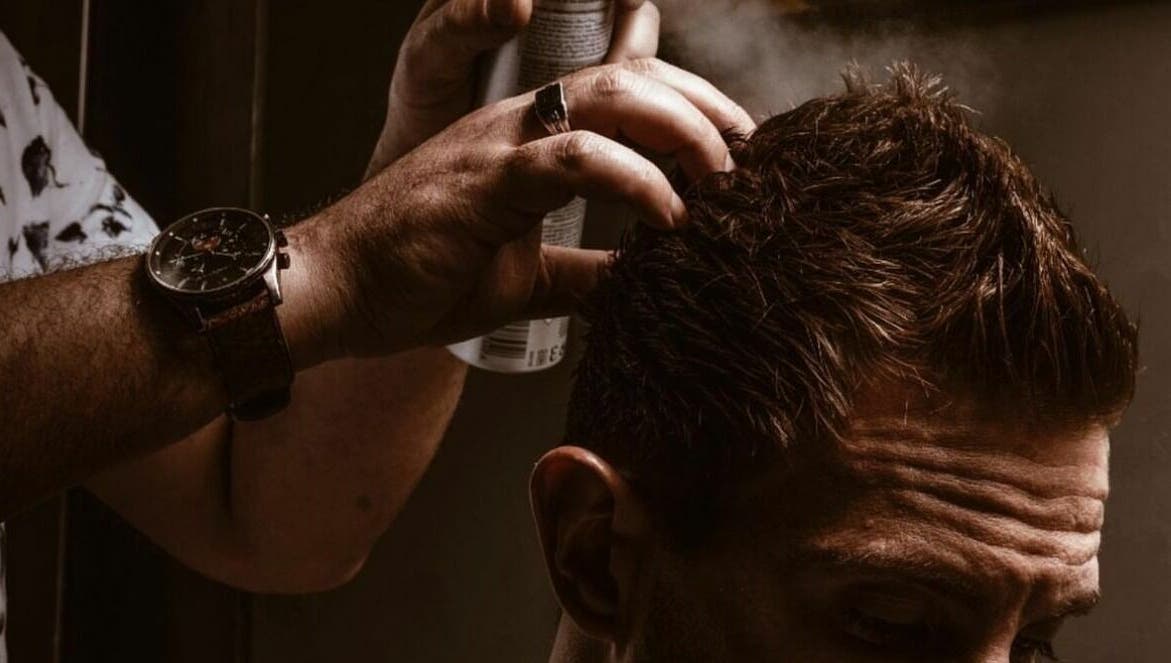 Expert hairstyling with spray at Touches Men Salon, Dubai, Dubai, AE offers top-notch grooming services.