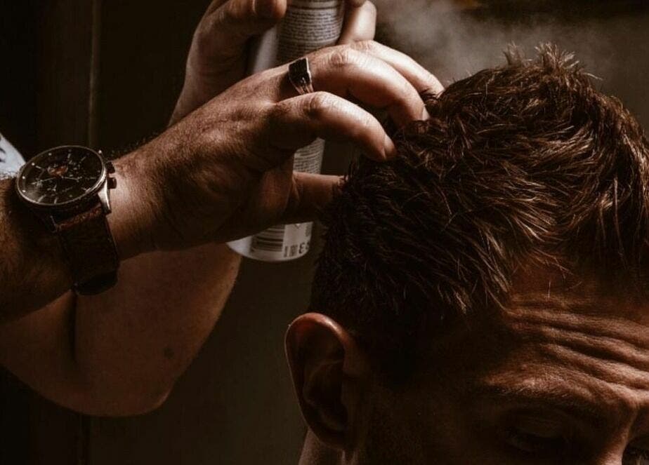 Expert hairstyling with spray at Touches Men Salon, Dubai, Dubai, AE offers top-notch grooming services.