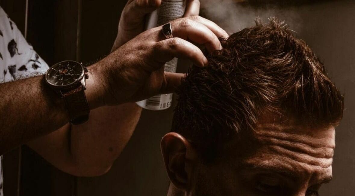 Expert hairstyling with spray at Touches Men Salon, Dubai, Dubai, AE offers top-notch grooming services.