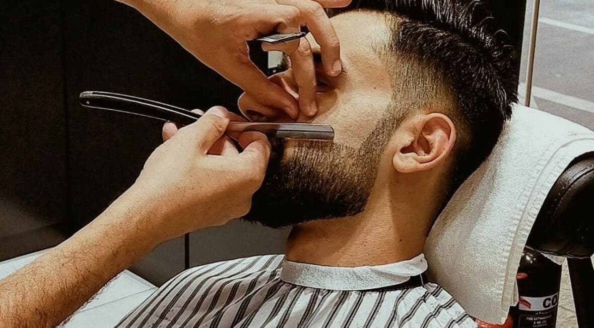 Professional beard trim at Touches Men Salon in Dubai, Dubai, AE, showcasing expert grooming skills.