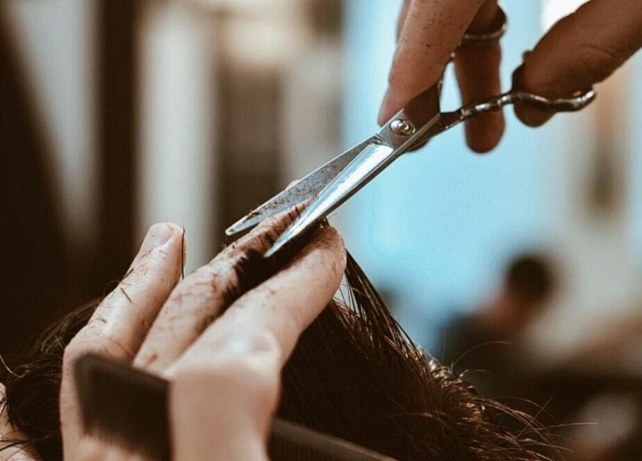 Professional haircut at Touches Men Salon, Dubai, Dubai, AE showcasing expert scissor skills.