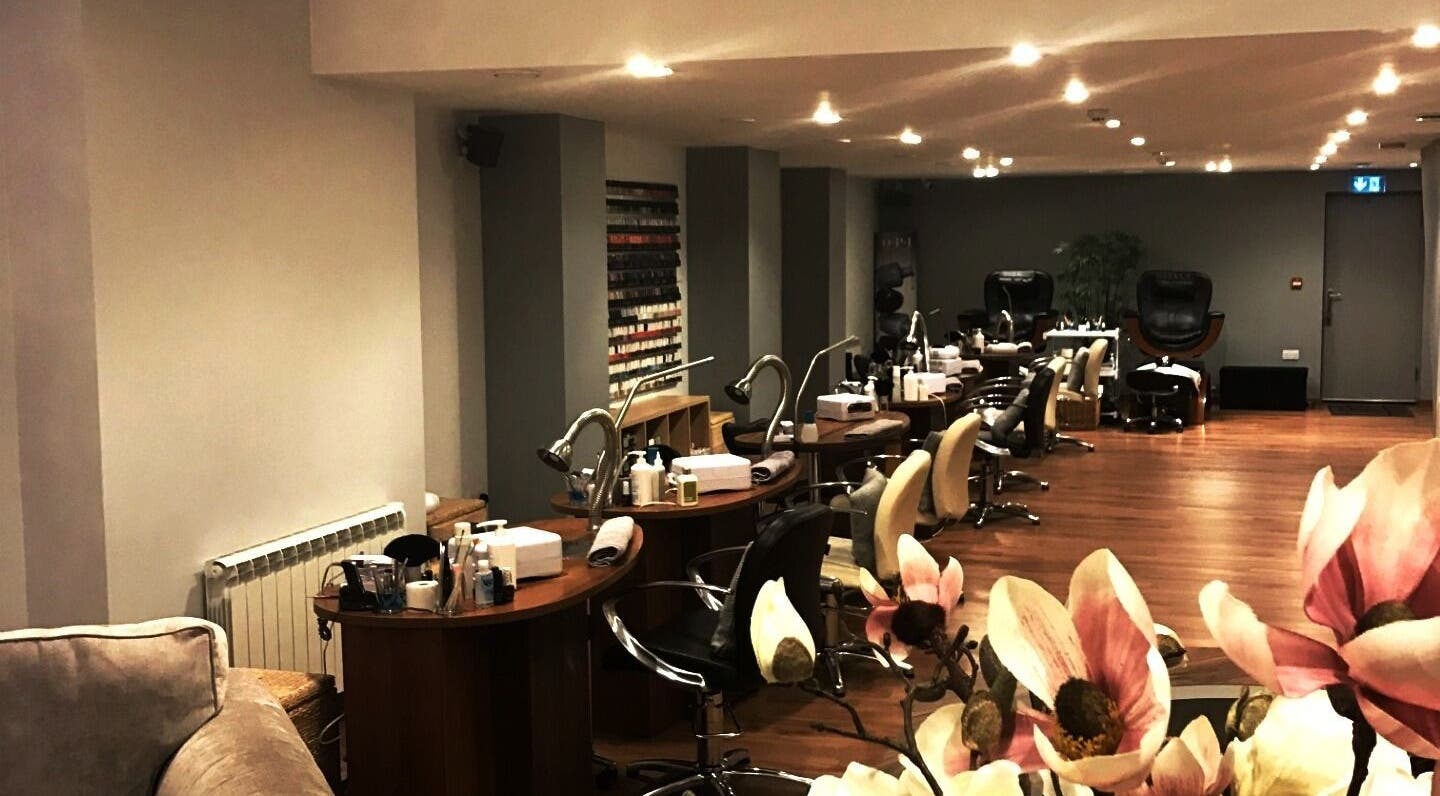 Interior of Natural Beauty Ltd in Saint Helier, St Helier, JE showcasing manicure stations and decor.