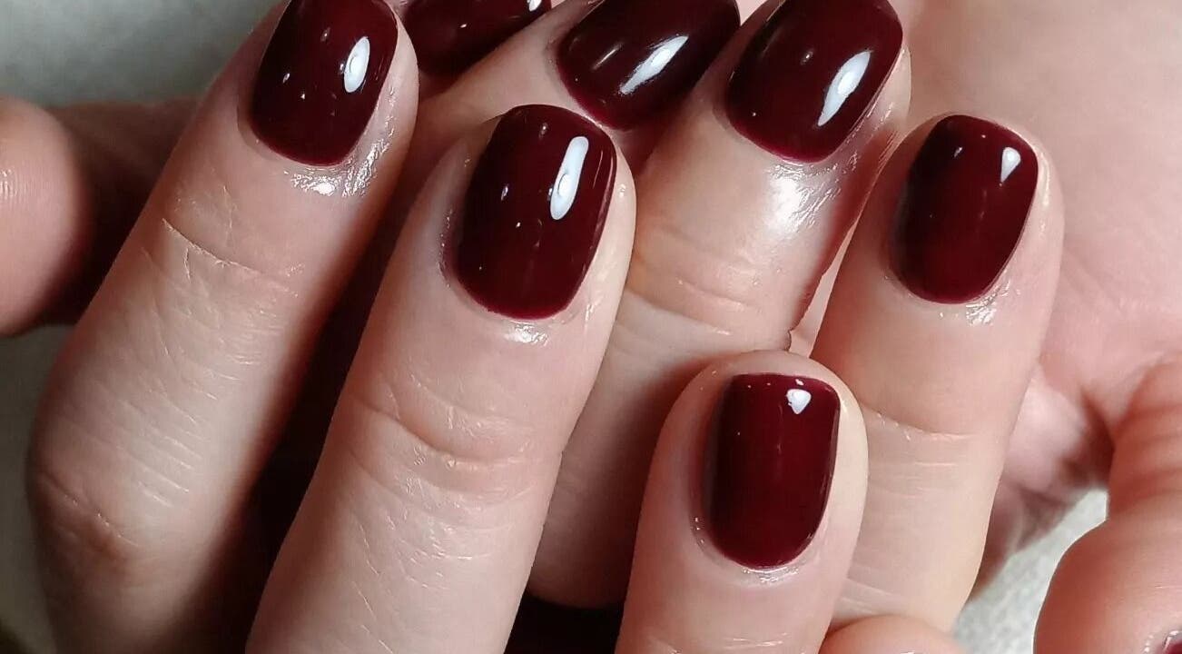Luxurious burgundy manicure at aQuaeria Nail & Lash, Hong Kong Island, Hong Kong Island, HK.