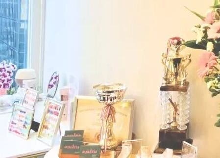 Awards and decor at aQuaeria Nail & Lash, Hong Kong Island, HK, showcasing elegance and achievement.