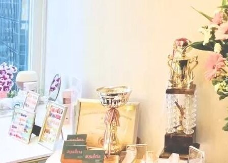 Awards and decor at aQuaeria Nail & Lash, Hong Kong Island, HK, showcasing elegance and achievement.