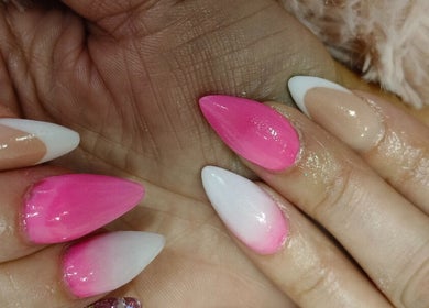 Stylish pink and white nail art at Beautiful New U, Boksburg, Gauteng, ZA, showcasing expert manicure.