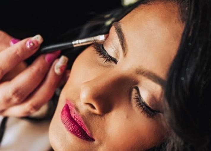 Makeup artist enhancing eyelid at Beautiful New U in Boksburg, Gauteng, ZA.