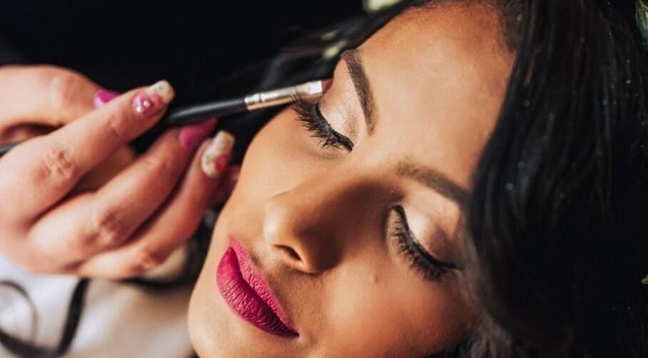Makeup artist enhancing eyelid at Beautiful New U in Boksburg, Gauteng, ZA.