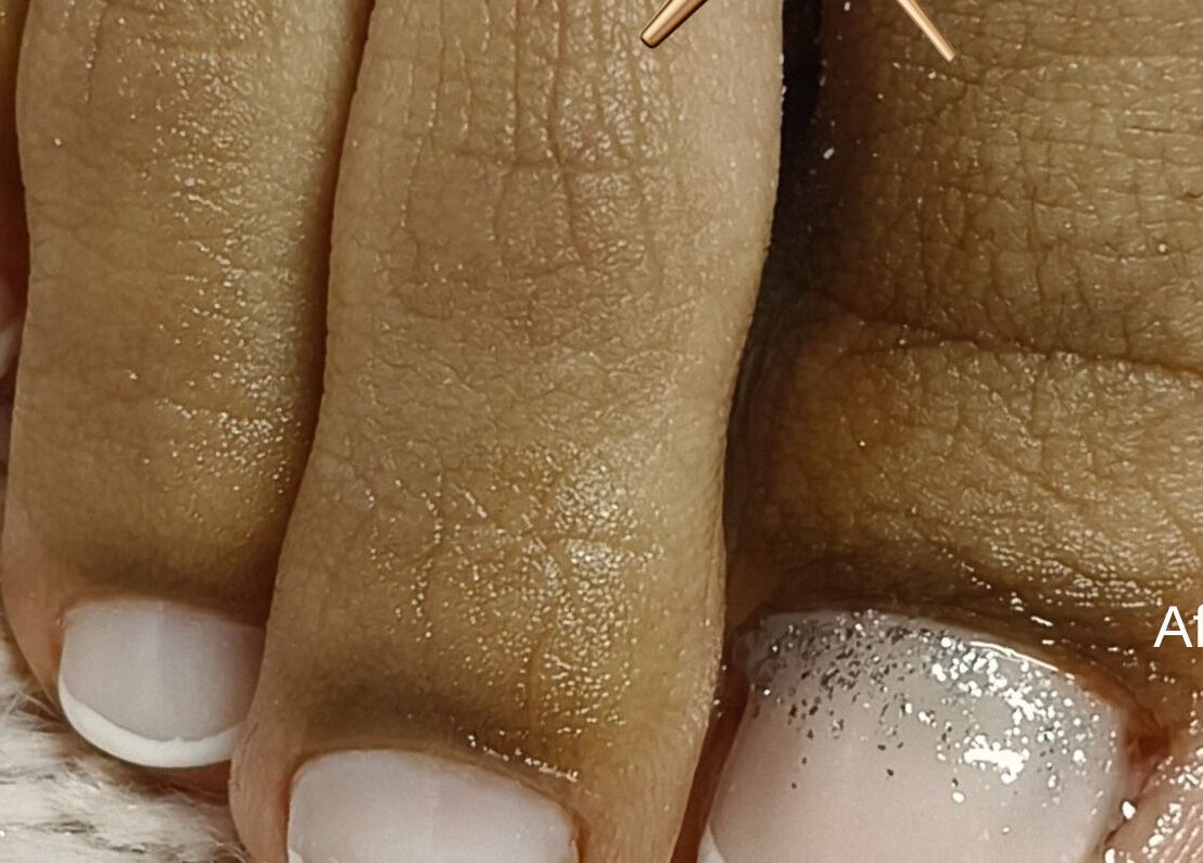 Glittering nail art pedicure at Beautiful New U, Boksburg, Gauteng, ZA. Close-up of toes with glitter polish.