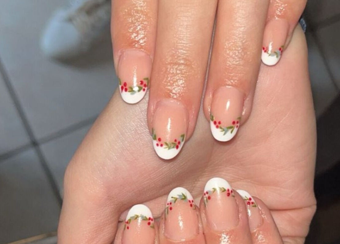 Elegant floral French manicure at Beautiful New U in Boksburg, Gauteng, ZA, showcasing artistry and style.