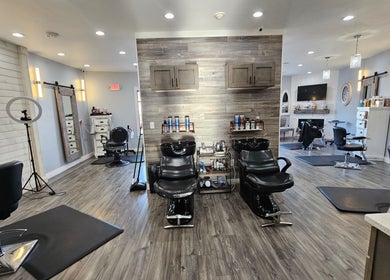 Chic interior of Salon Legacy located in Fall River, Massachusetts, US, showcasing modern salon chairs and stylish decor.