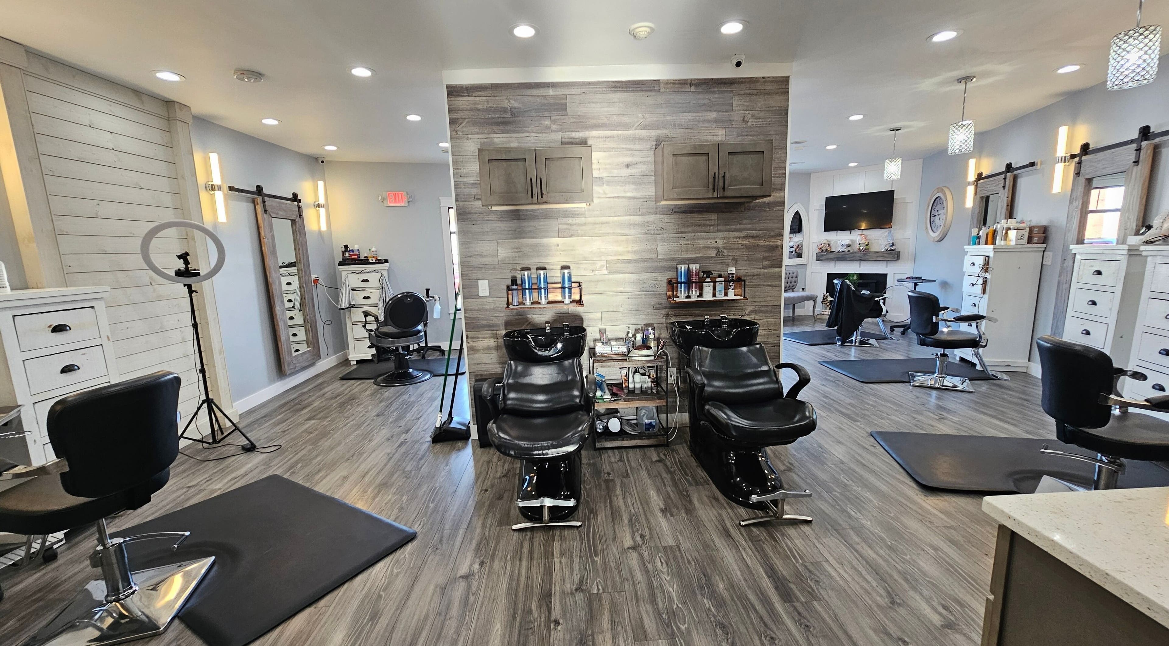 Chic interior of Salon Legacy located in Fall River, Massachusetts, US, showcasing modern salon chairs and stylish decor.