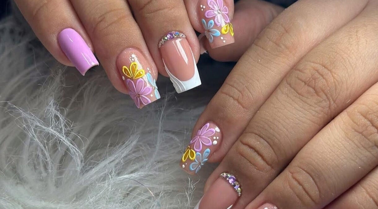 Vibrant floral nail art at Belle Ame Beauty and Nails, Millwater, Auckland, NZ, showcasing colorful intricate designs.