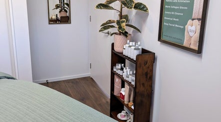 A serene treatment room at My Beauty Treat in Woodend, Canterbury, NZ, featuring elegant shelves and decor.