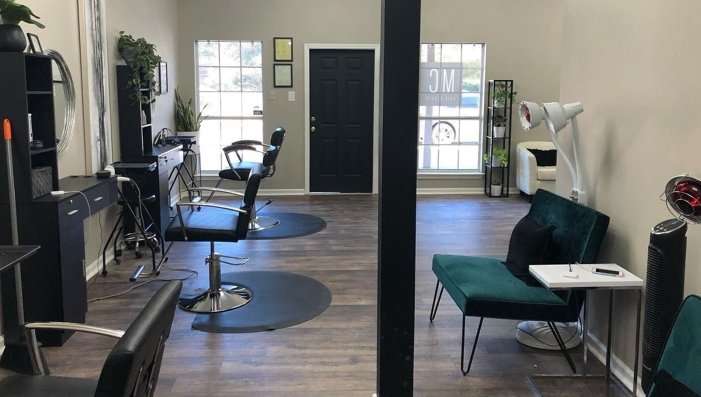 Modern interior of MC Hair Studio in Little Rock, Arkansas, US with styling chairs and elegant decor.