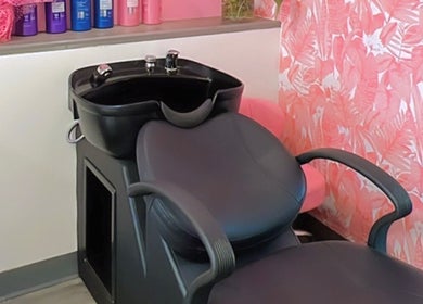 Modern wash station at Politur Nails Beauty Lounge in Los Angeles, California, US with floral wallpaper.