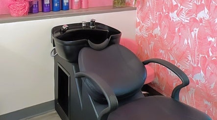 Modern wash station at Politur Nails Beauty Lounge in Los Angeles, California, US with floral wallpaper.