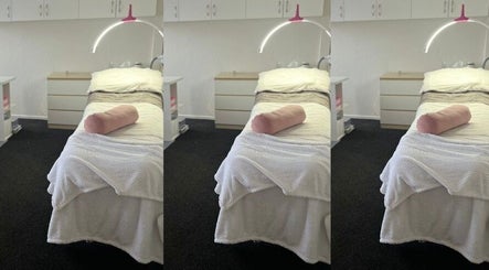 Relaxing treatment room at Hayley Maree's Beauty Howick in Auckland, Auckland, NZ, with a cozy bed setup.