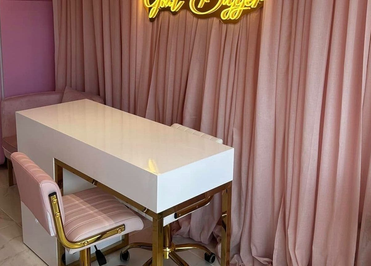 Stylish beauty station at Ohh Beau, Gosport, England, GB with pink decor and elegant seating.