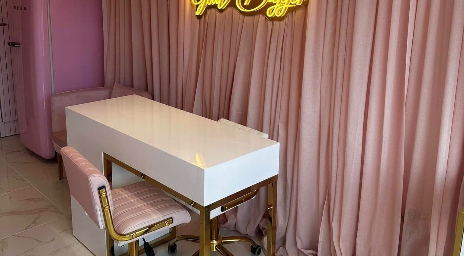 Stylish beauty station at Ohh Beau, Gosport, England, GB with pink decor and elegant seating.