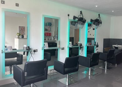 Modern styling chairs and mirrors at Be Hair Salon Ltd in Bournemouth, England, GB.