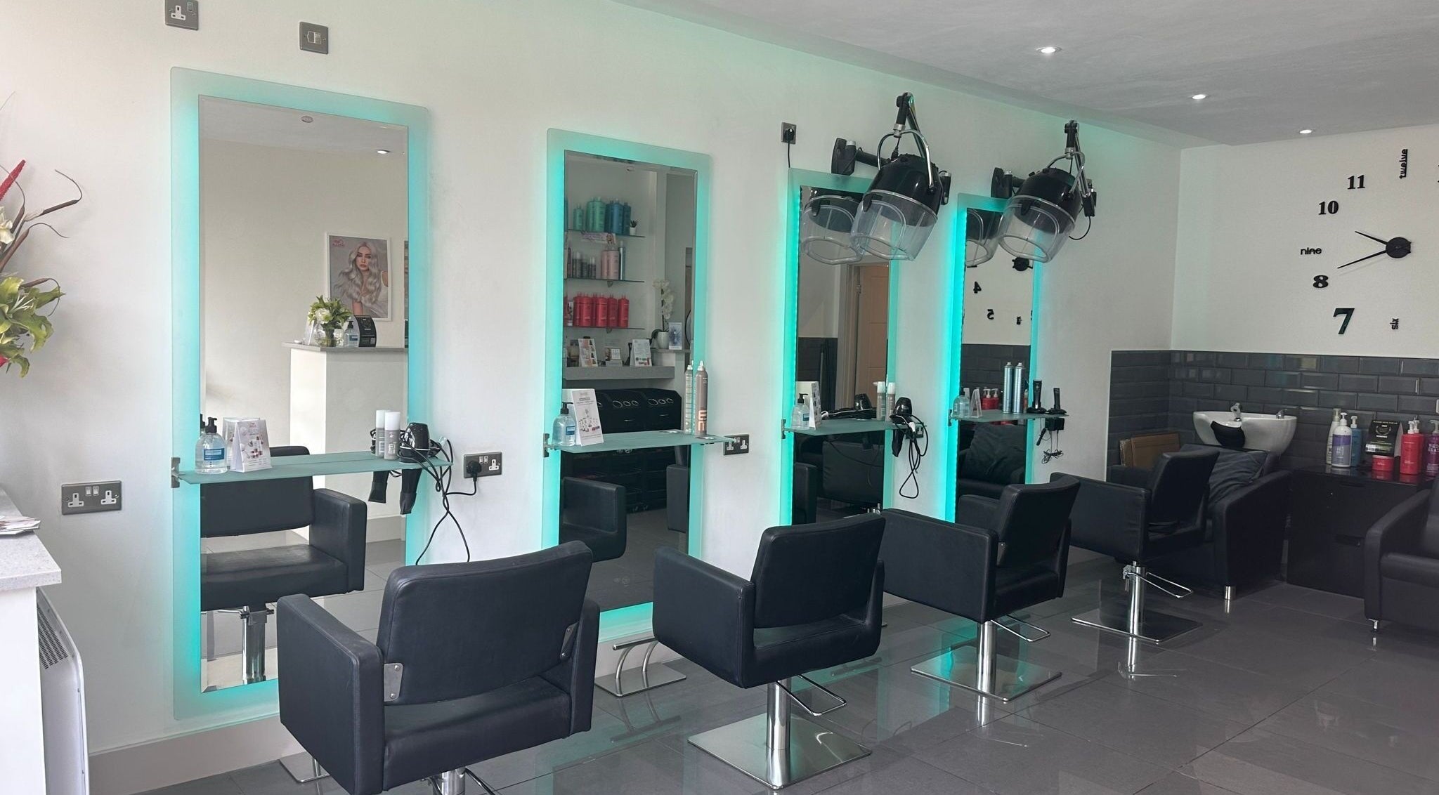 Modern styling chairs and mirrors at Be Hair Salon Ltd in Bournemouth, England, GB.