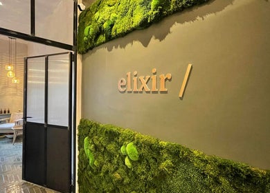 Elixir entrance with moss wall at Royal Leamington Spa, England, GB, offering a tranquil and inviting ambiance.