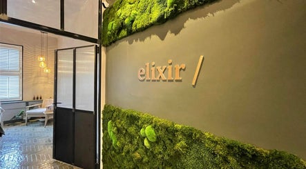Elixir entrance with moss wall at Royal Leamington Spa, England, GB, offering a tranquil and inviting ambiance.