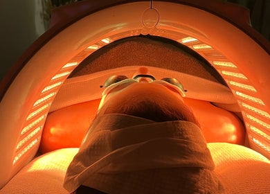 Relaxing under LED light therapy at elixir/ Royal Leamington Spa, England, GB.