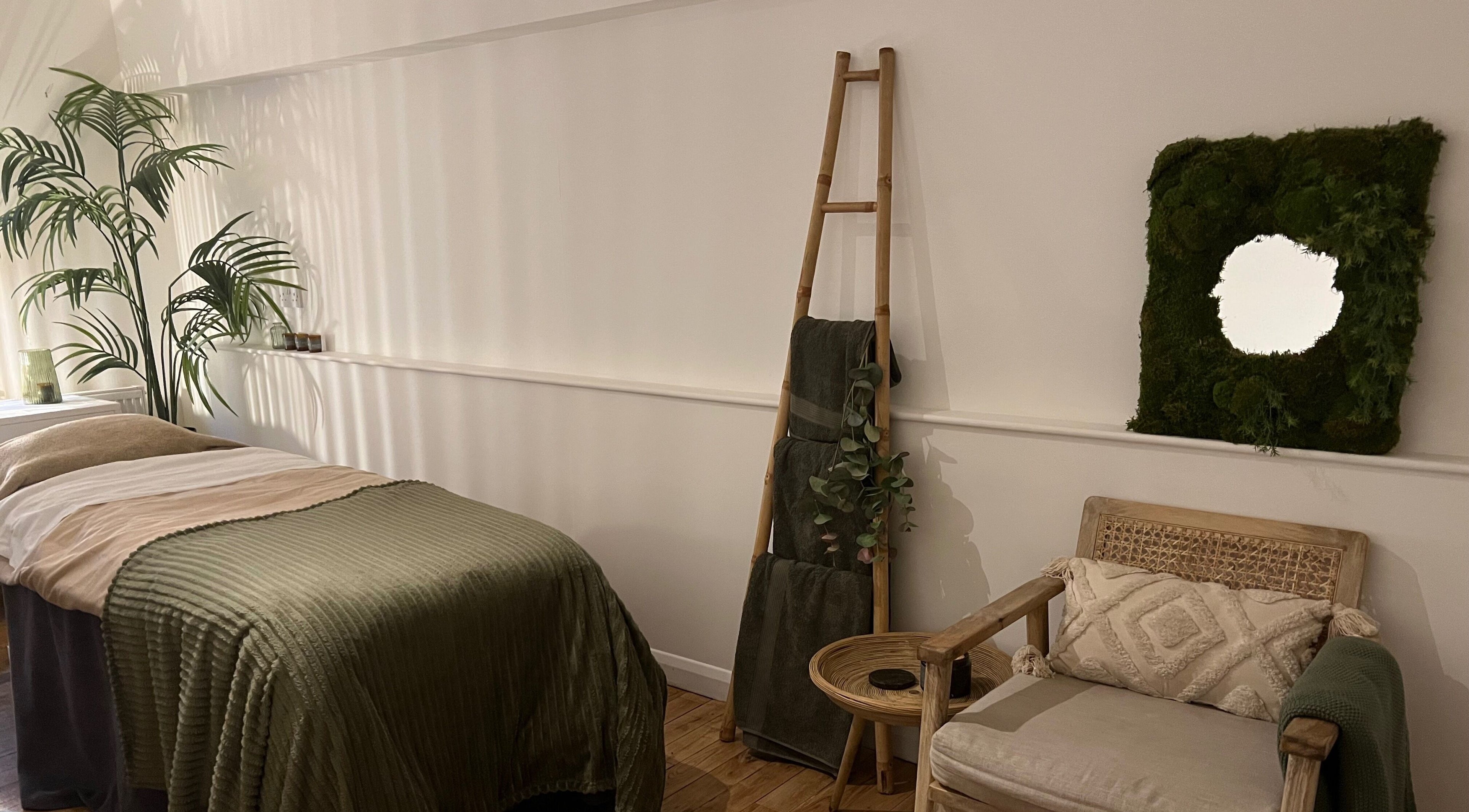 Relaxing treatment room at elixir, Royal Leamington Spa, England, GB with soothing decor and greenery.