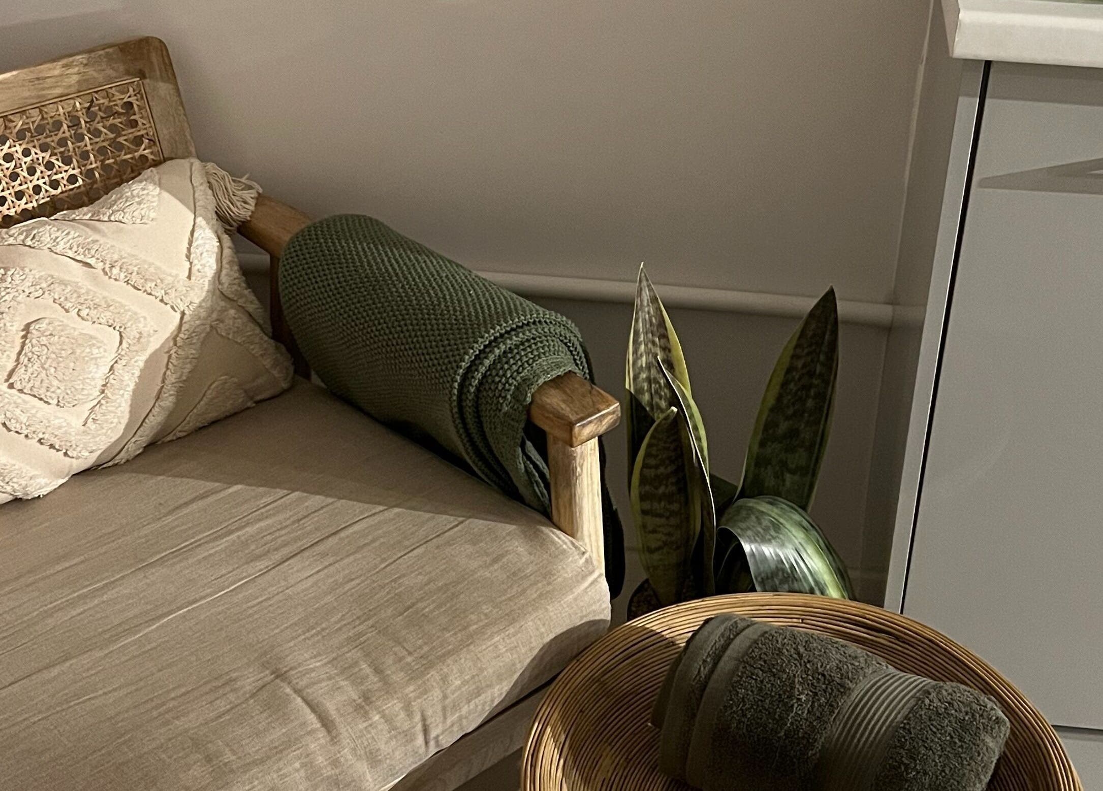 Cozy seating area with a plush pillow at elixir/ Royal Leamington Spa, England, GB offering relaxation.