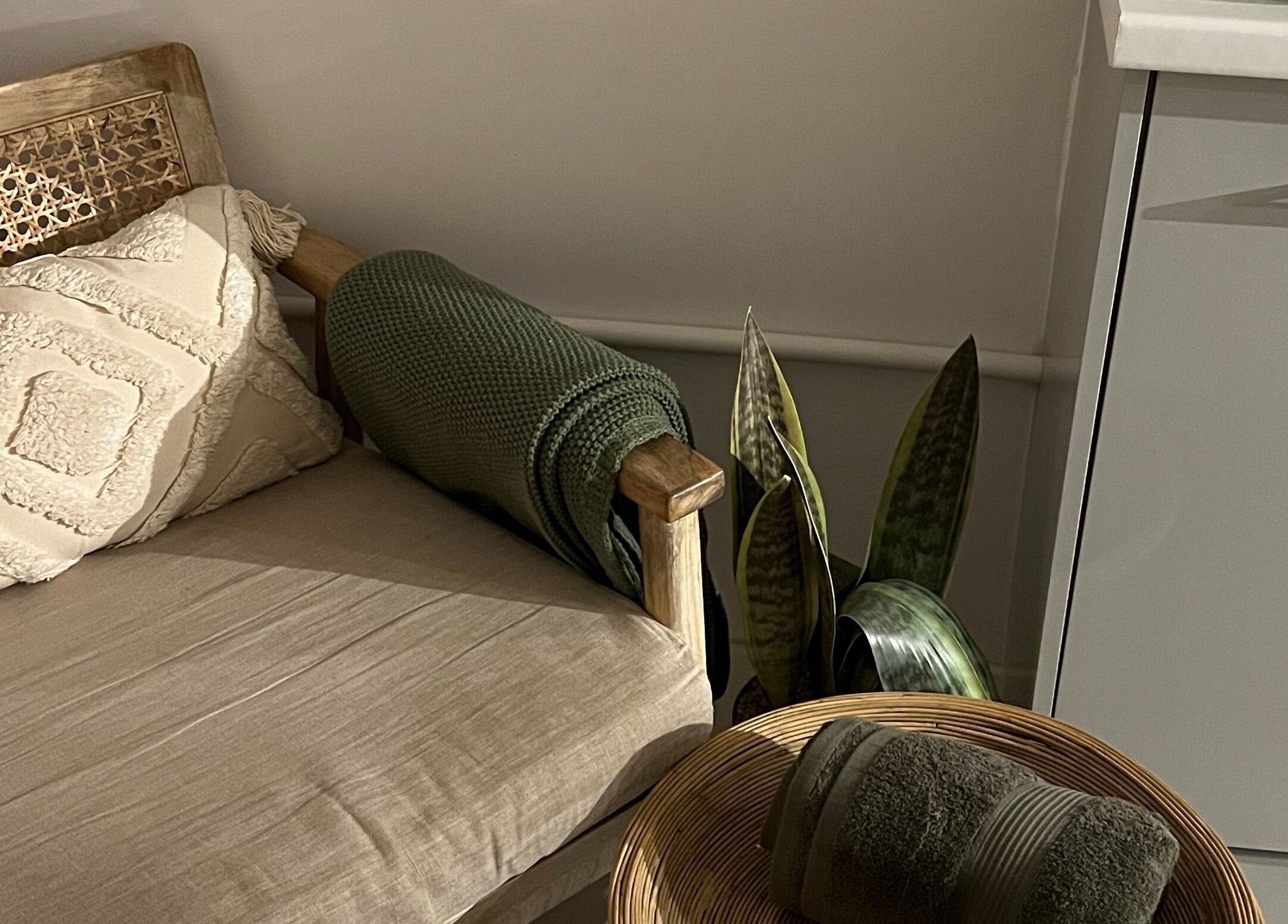 Cozy seating area with a plush pillow at elixir/ Royal Leamington Spa, England, GB offering relaxation.