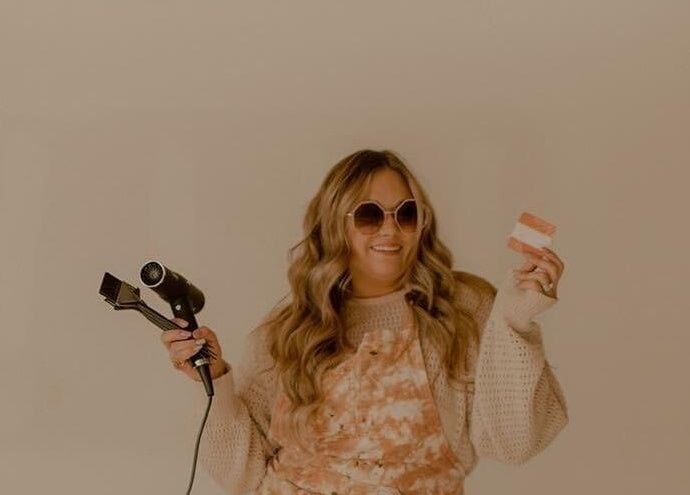 Lucy at C Reflections Salon & Day Spa, Morrill, Nebraska, US, showcasing hair styling tools.