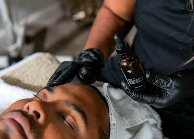 Facial treatment at The DermLab, Freeport, TT with a relaxing serum application.