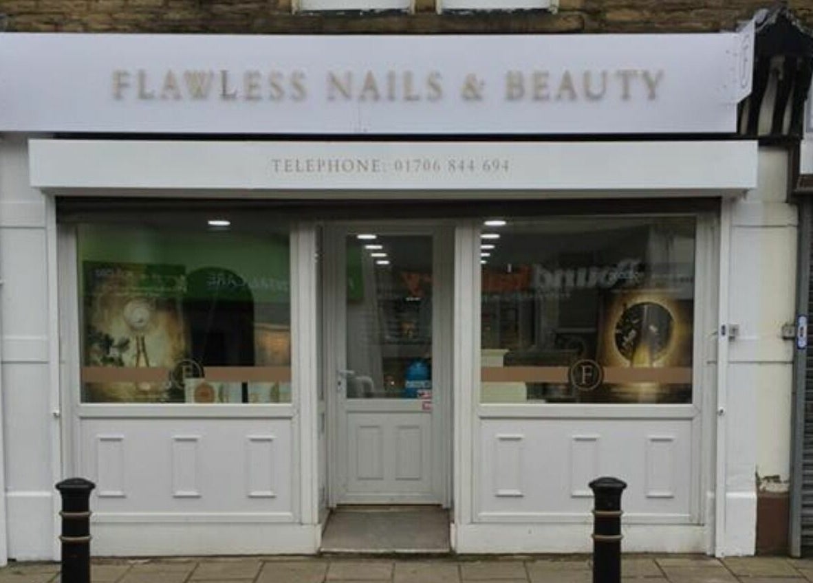 Front view of Flawless Salon in Shaw, England, GB showcasing welcoming entrance.