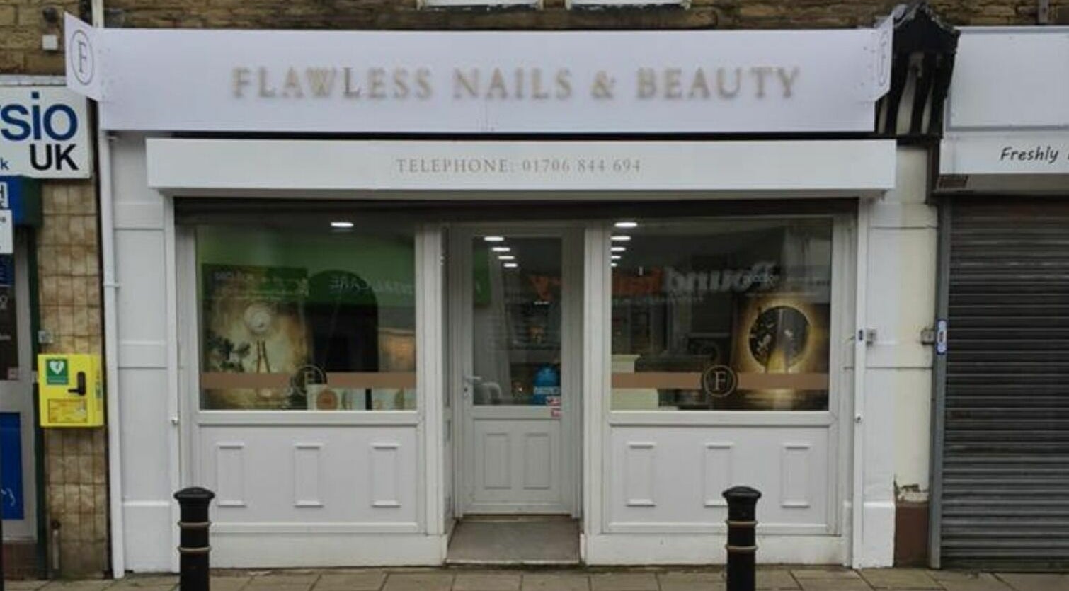 Front view of Flawless Salon in Shaw, England, GB showcasing welcoming entrance.