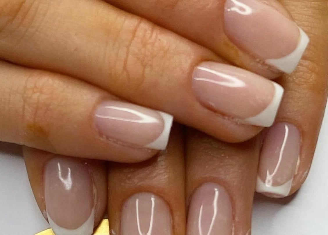 Elegant French manicure nails at Flawless, Shaw, England, GB. Perfect blend of classic style and modern beauty.