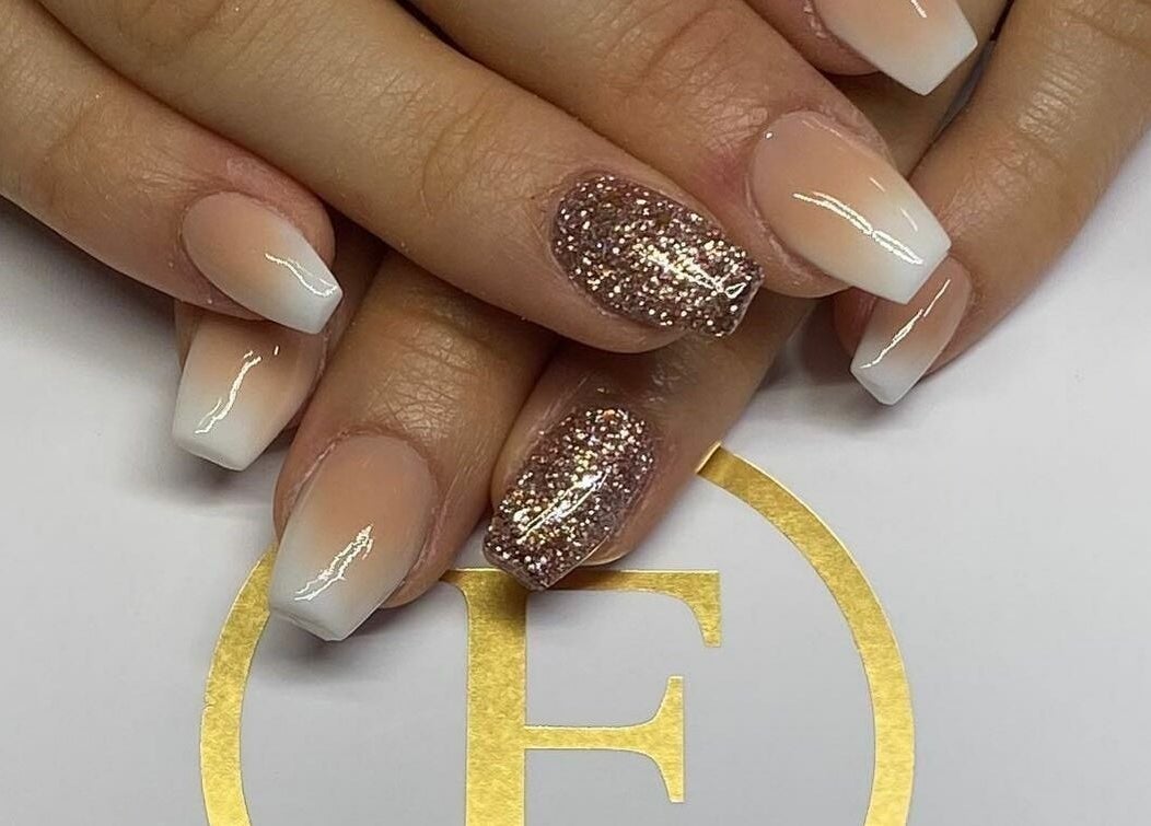 Stylish French manicure with glitter accent at Flawless, Shaw, England, GB.